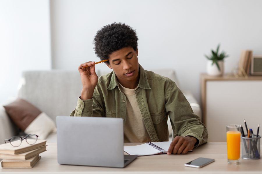 student completing online assessment via distance learning