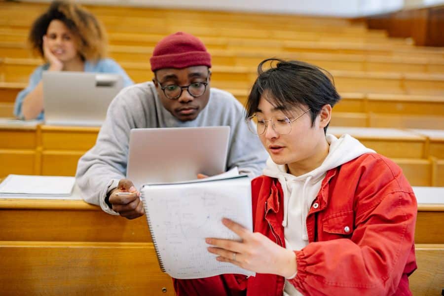 students studying from past exam papers