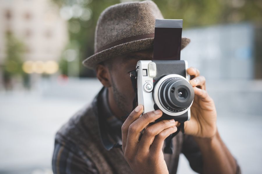 student practicing photography during school holidays