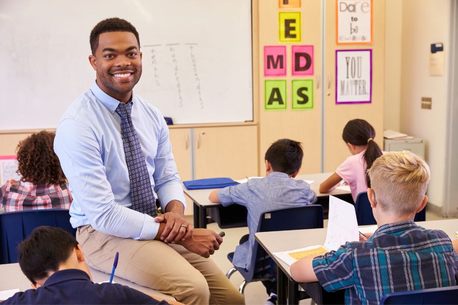 man teaching learners after completing degree